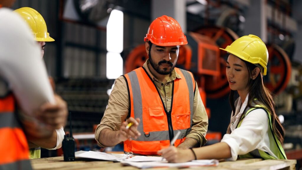 Construction engineers discussing warehouse project plan